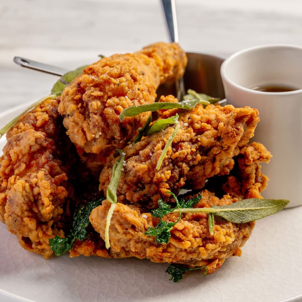 Smoked fried chicken from High Steaks Vegas, a modern steakhouse set to debut in October 2025 atop Rio's Masquerade Tower near the Las Vegas Strip.