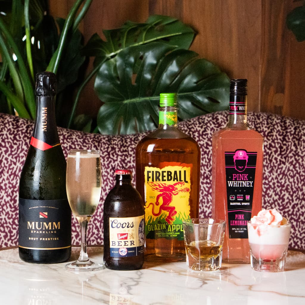 picture of the monthly drink specials and the bottles of liquor